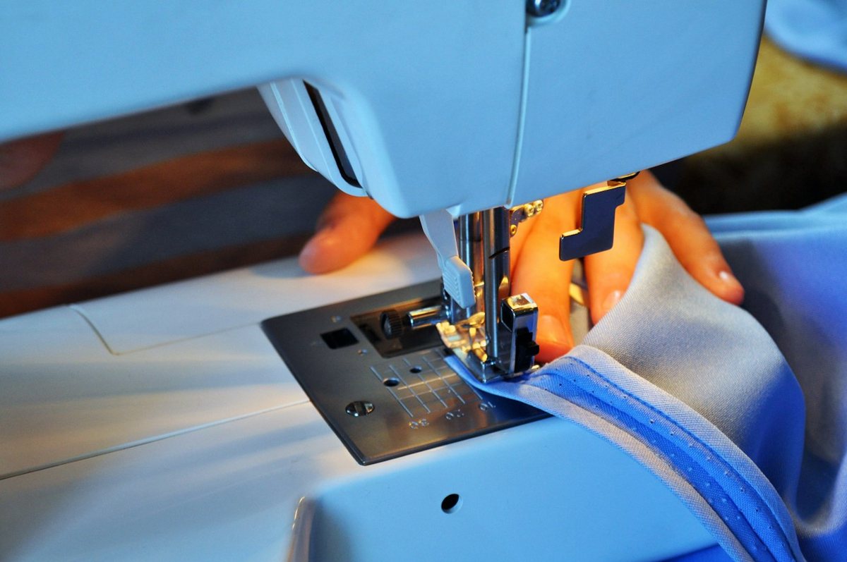 Person sewing on a machine
