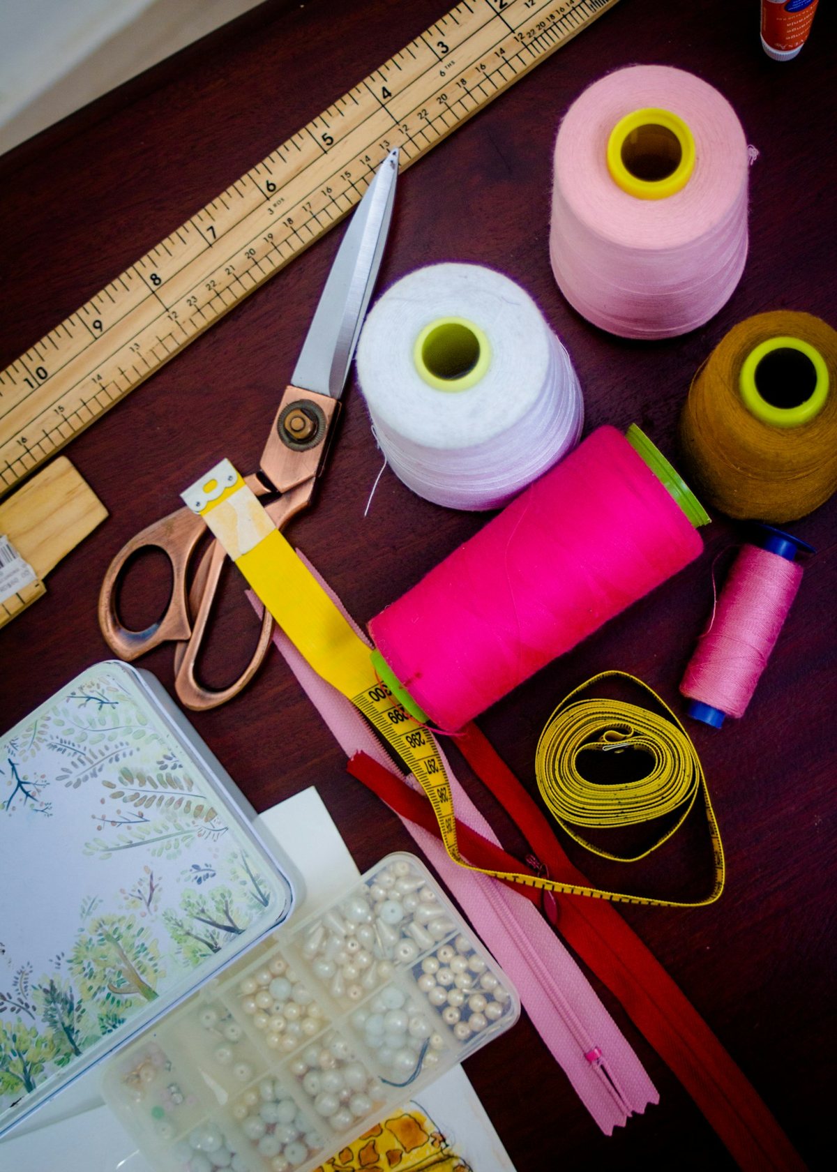 Thread spools beside scissors